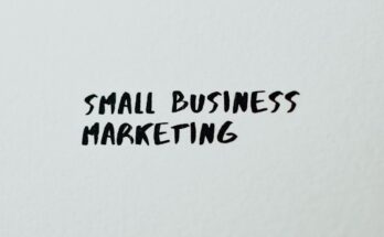 Text 'Small Business Marketing' written on white paper for creative use.